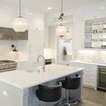 White kitchen with glass pendant lights