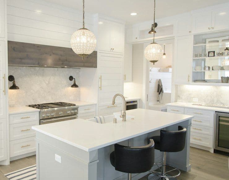 White kitchen with glass pendant lights