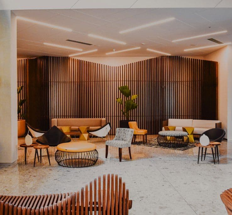 Lounge with timber slat wall and warm lighting