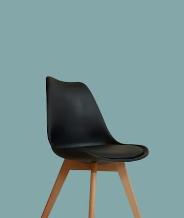 Black moulded dining chair with oak legs