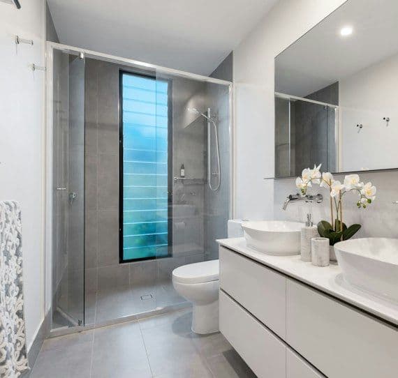Bright bathroom with vessel basin and wall-hung toilet