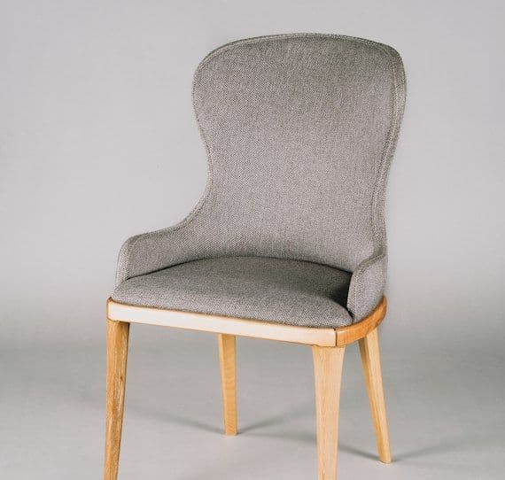 Grey upholstered chair with oak frame