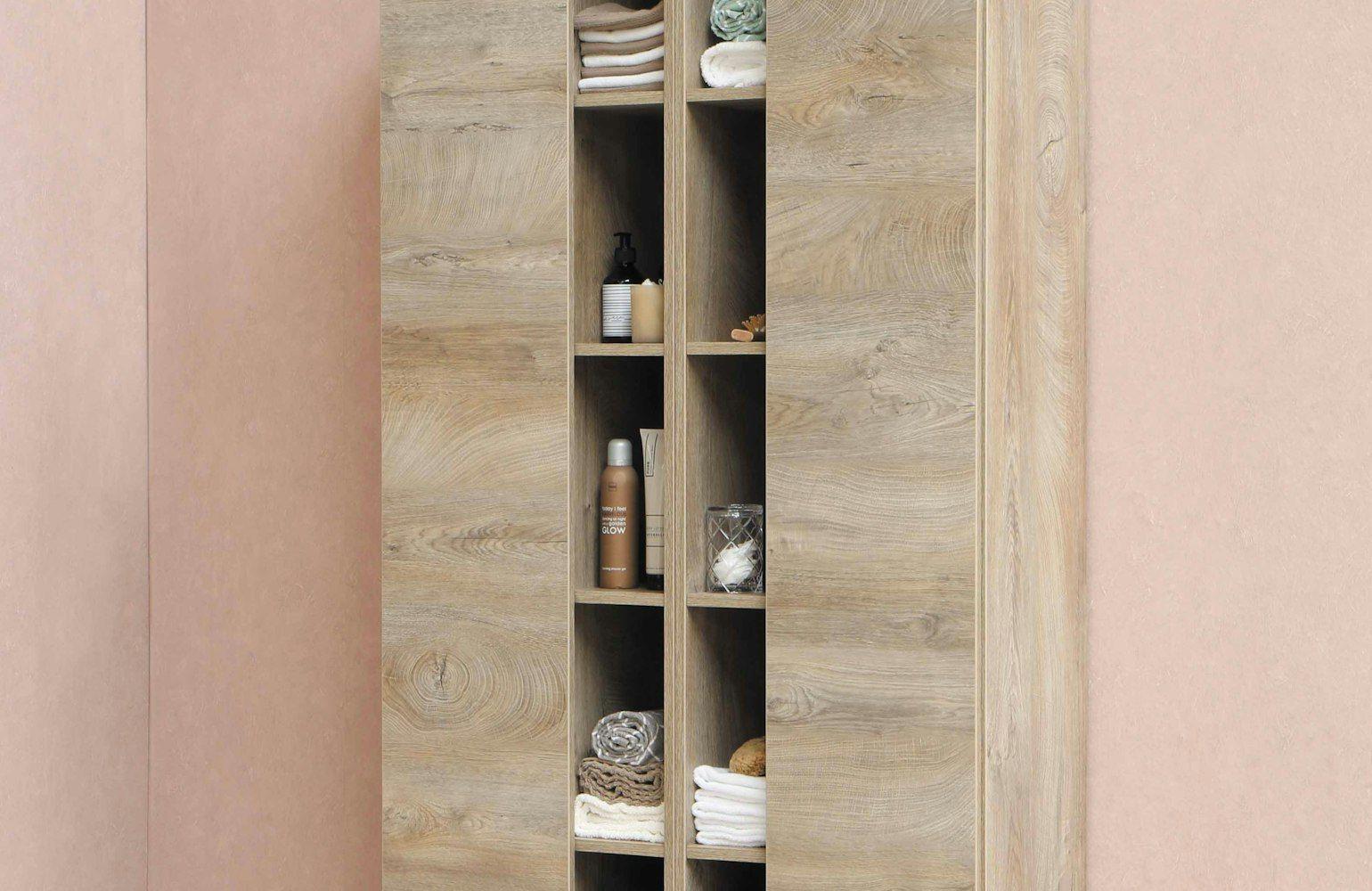 Timber shelving unit against a blush pink wall